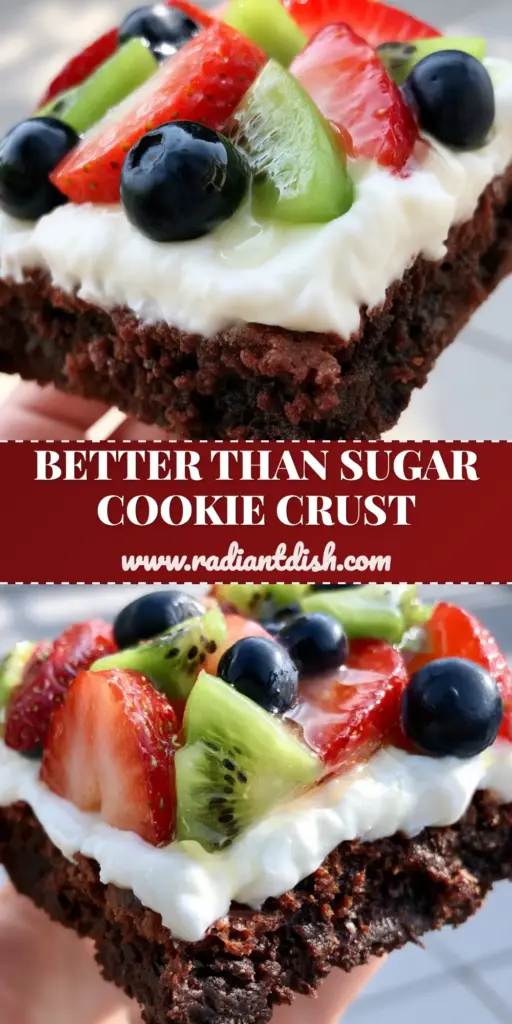 A top-down view of a completed brownie fruit pizza with a fudgy chocolate base, white frosting, and a rainbow of fresh berries and kiwi. (brownie fruit pizza)