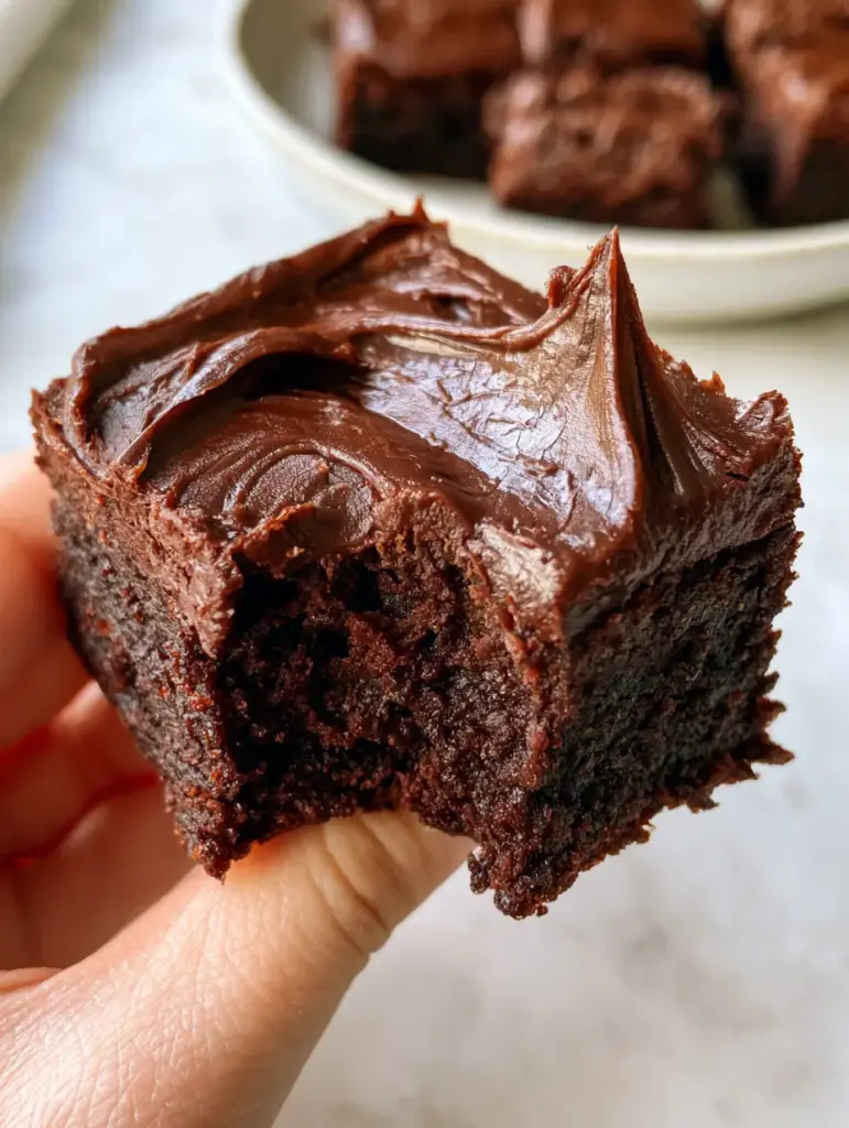 Lunch Lady Brownies: The Ultimate Fudgy Old-School Cafeteria Classic 1 Clean-cut square edges of lunch lady brownies on a marble countertop with soft natural light.